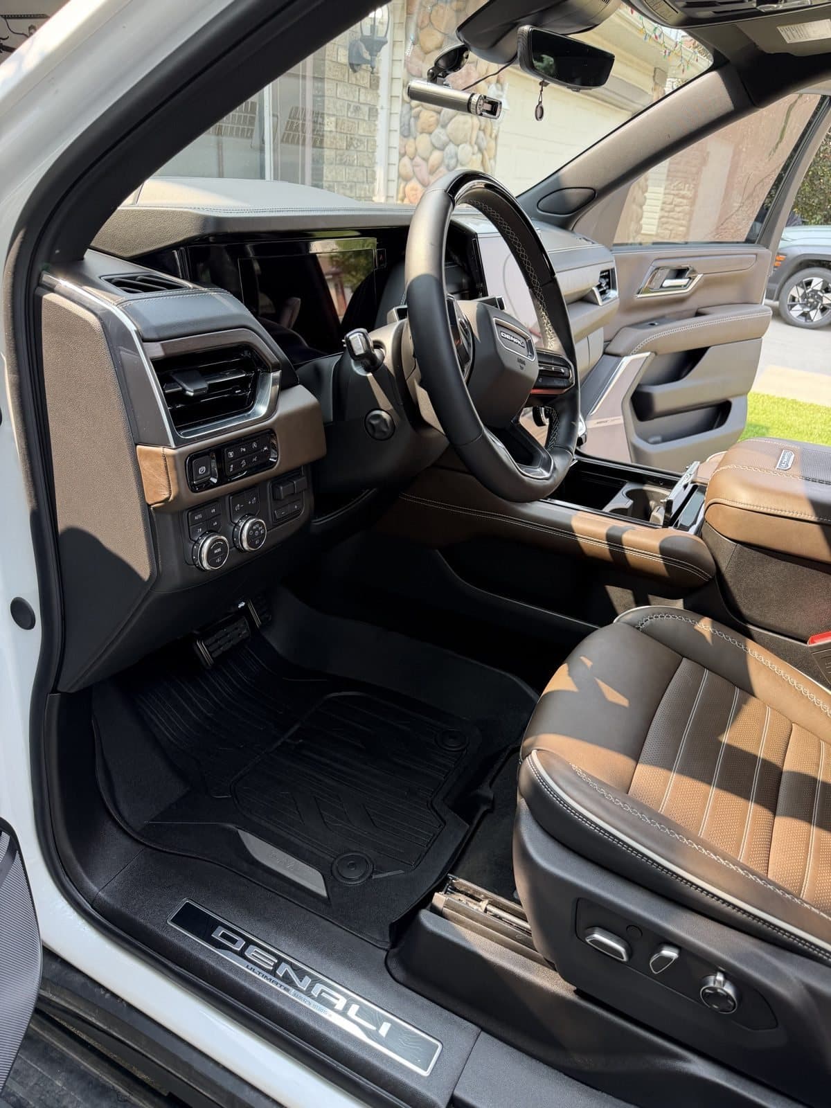 The same Denali after detailing, floor mat and brown leather seat cleaned up
